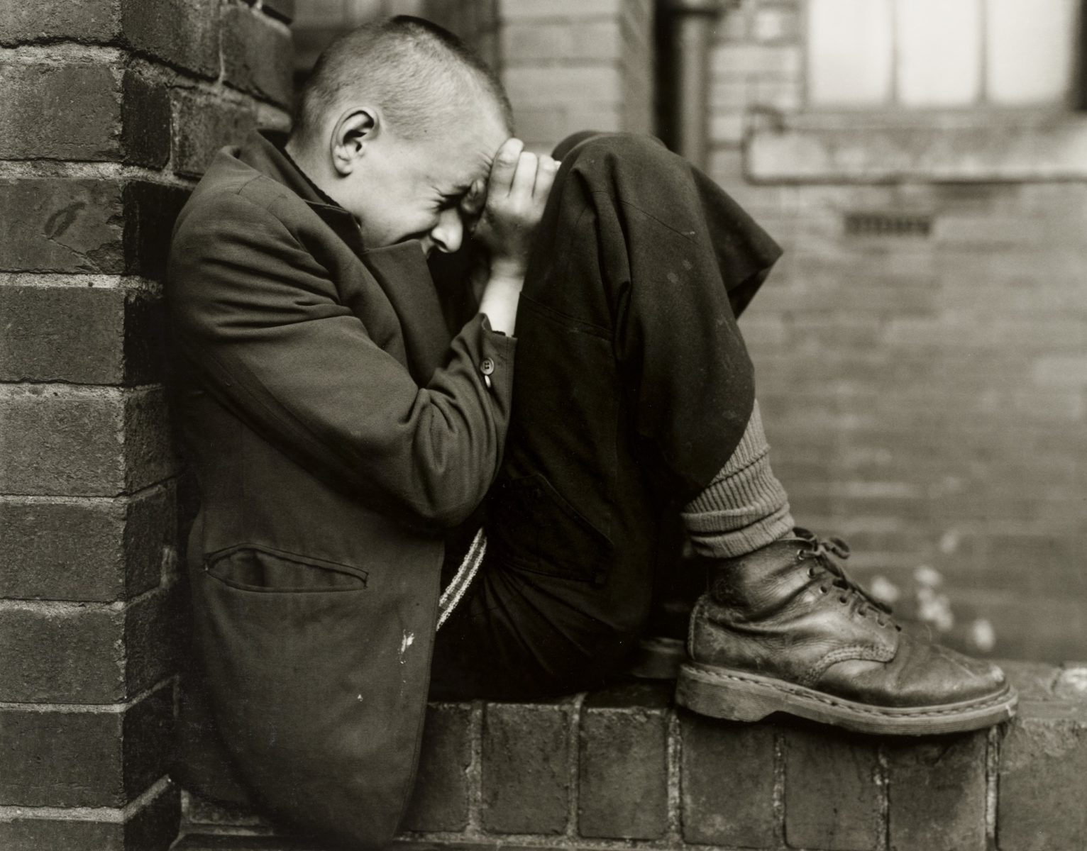 Youth on wall, Jarrow, Tyneside, UK, 1976 by Chris Killip - Photography and solitude