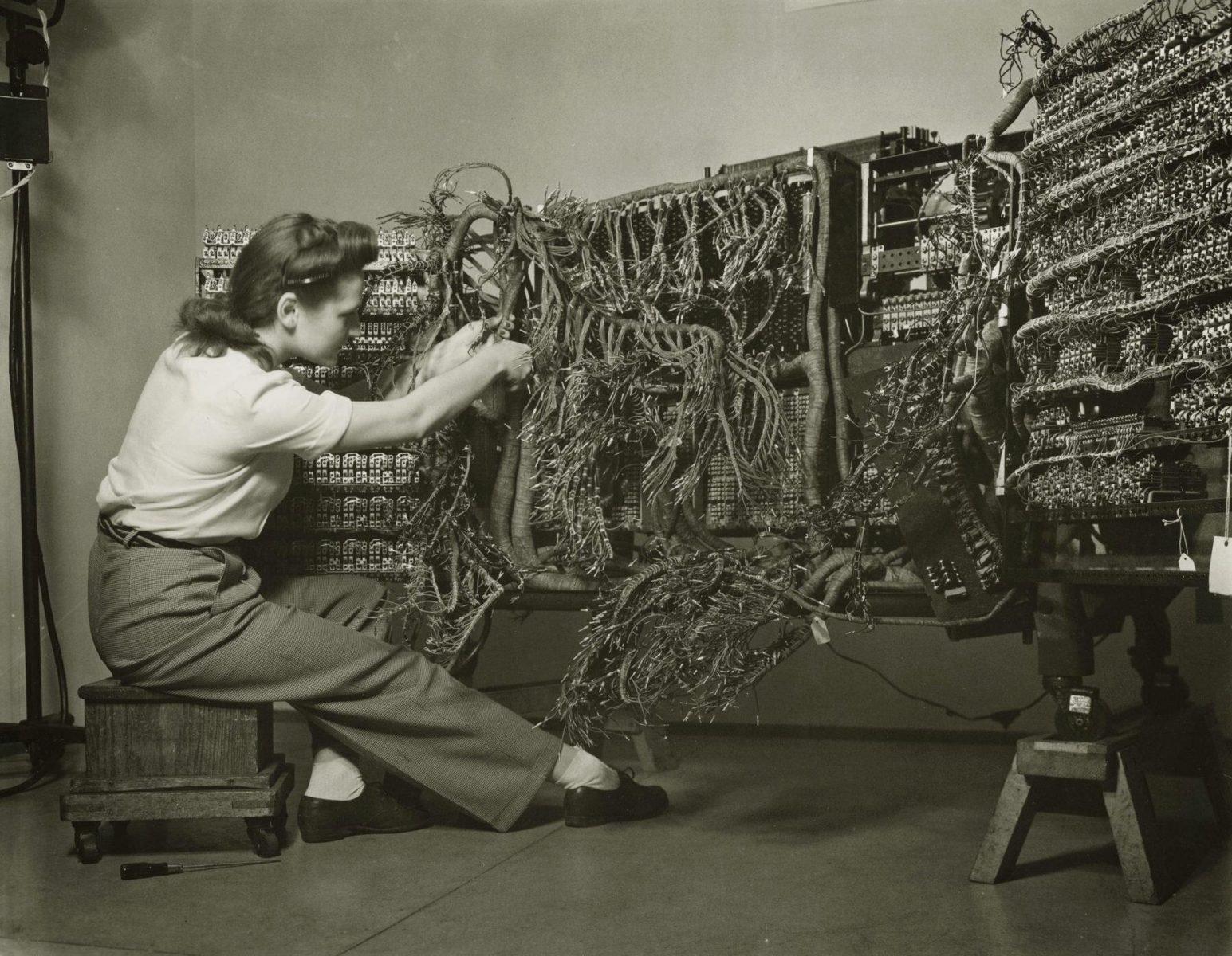 Woman wiring an early IBM computer, from the documenting science series, 1958 © Berenice Abbott Legendary Women in Photography