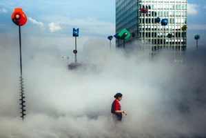 'In the clouds' In Paris, in Le Bassin Takis, a woman takes advantage of the misters. With the heat wave hitting the city, the need for fresh air is felt.