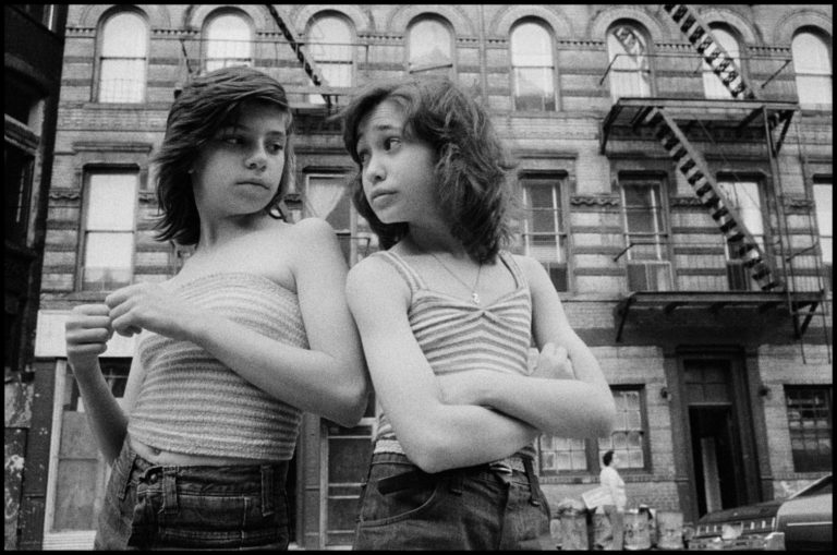 Dee and Lisa on Mott Street. Little Italy. NYC, USA. 1976 Black and white photography by Susan Meiselas