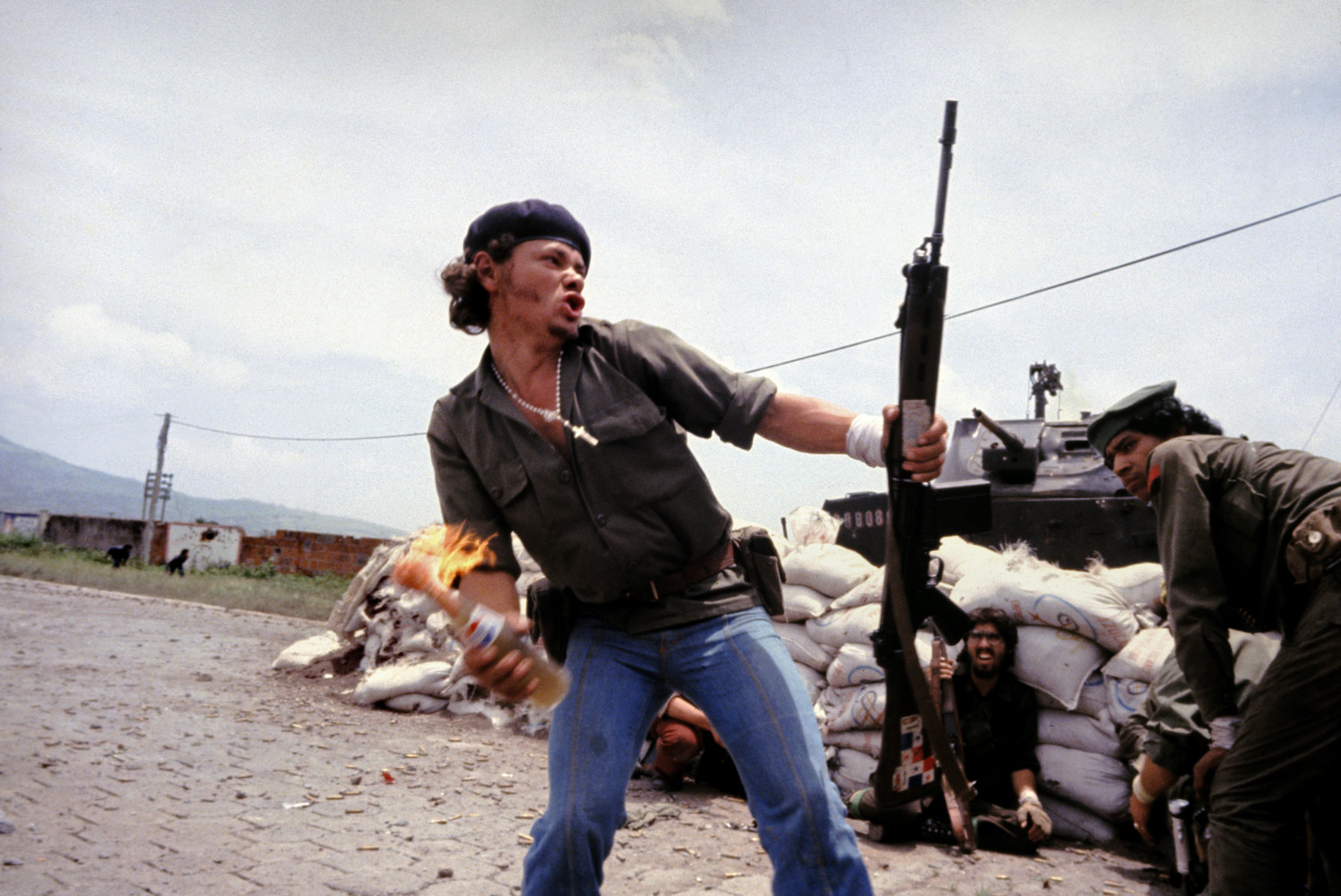 ‘Molotov Man’ -Sandinistas at the walls of the Esteli National Guard headquarters. July 1979, Nicaragua © Susan Meiselas