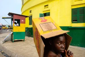 a young girl walking the streets of Accra, Ghana