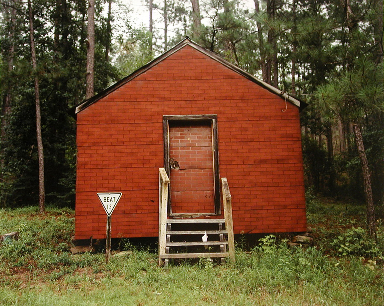 Color photography, Red Building in Forest, Hale County, Alabama, 1974 © William Christenberry
