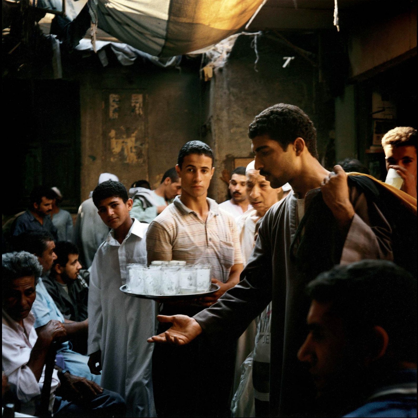 A limonade salesman in the souk, Cairo, 2000 photograph by Denis Dailleux