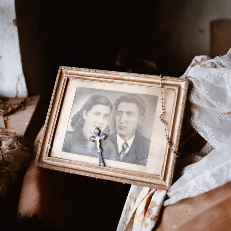 Color photo by Tadas Kazakevičius from Soon to be Gone, abandoned portrait, rosary beads