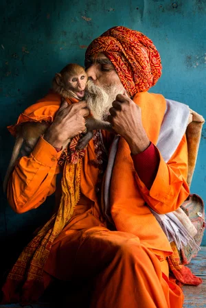 color portrait photo of hindu man and his monkey by Somraj Sahu