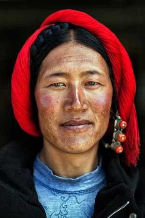 color close up portrait of a Tibetan man by Xavier Orignac