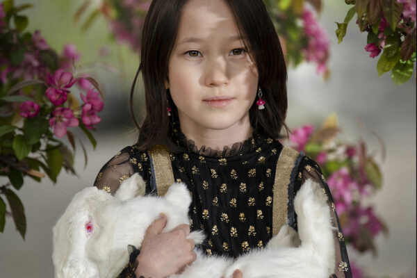 color portrait of a young girl and her white rabbit by Ali Smith