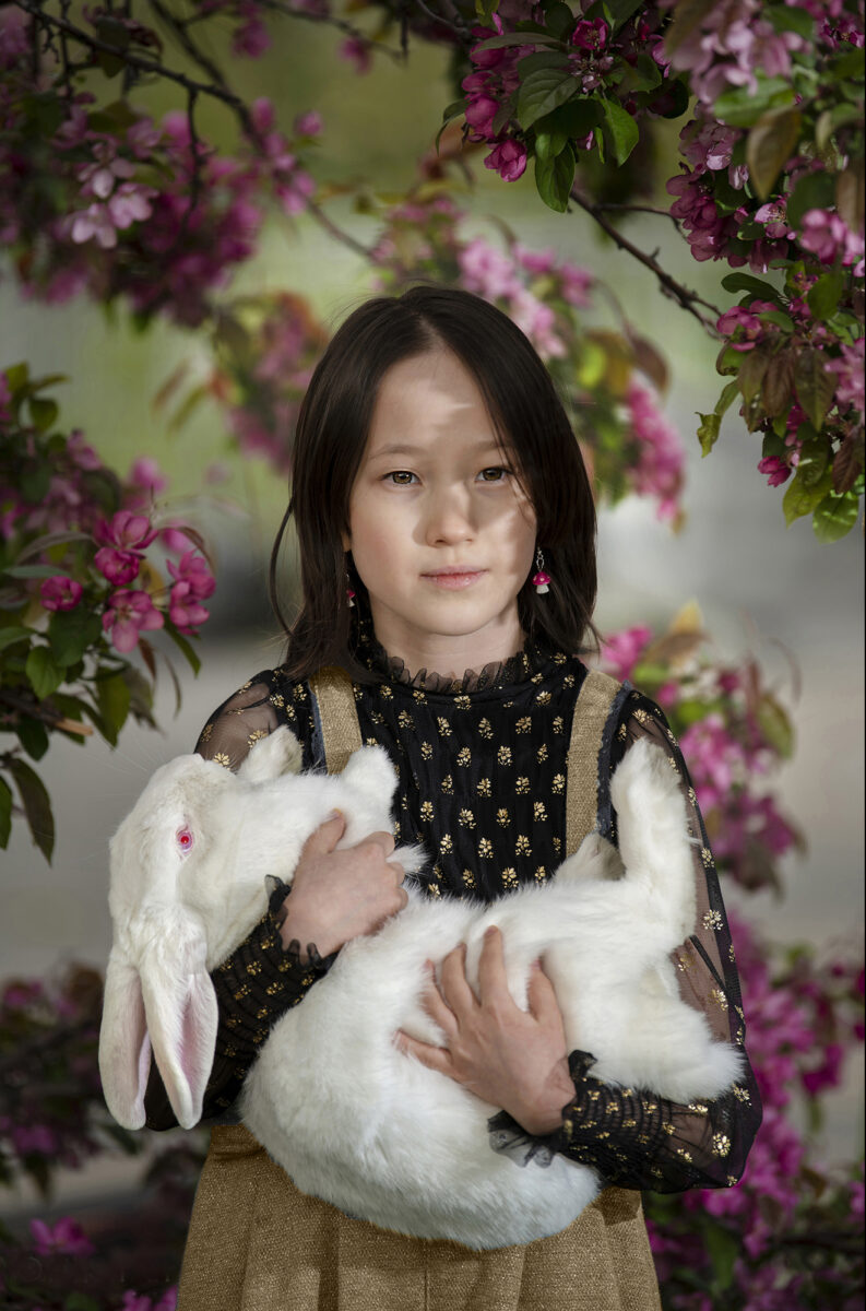 color portrait of a young girl and her white rabbit by Ali Smith