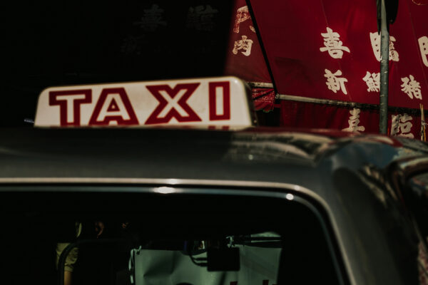 street color photograph of taxi in Hong kong