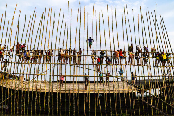 color photograph of men on a boat in Bangladesh by Md Arifuzzaman