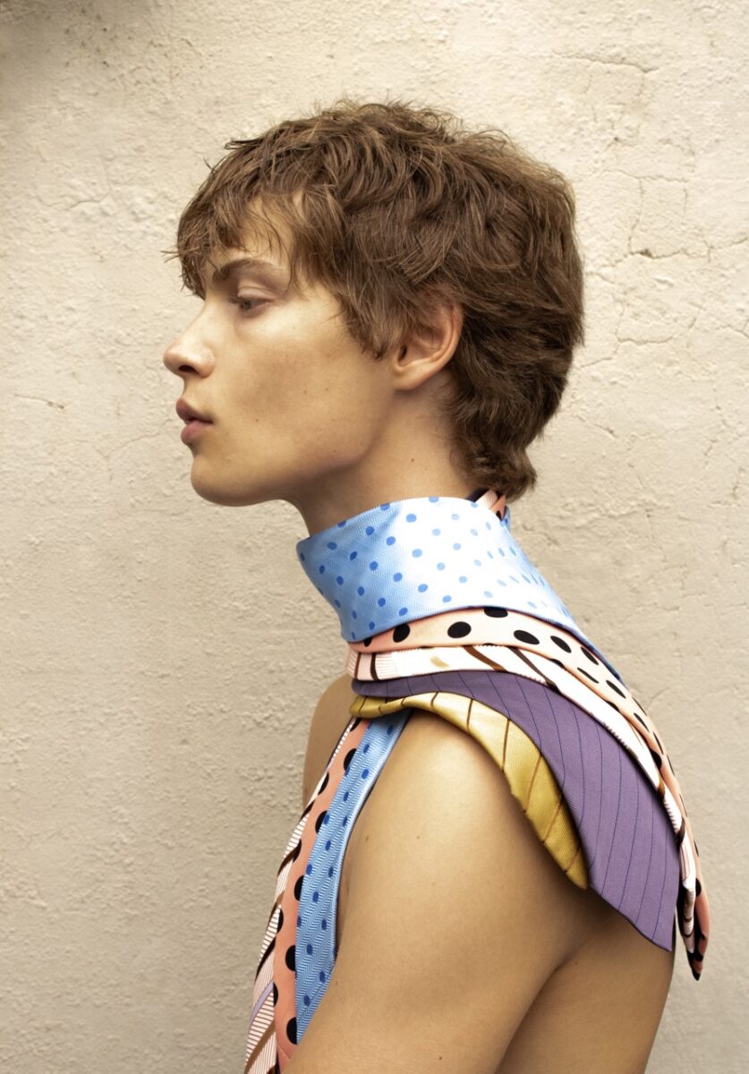 color fashion studio portrait of a male model wearing ties by Blake Sutherland
