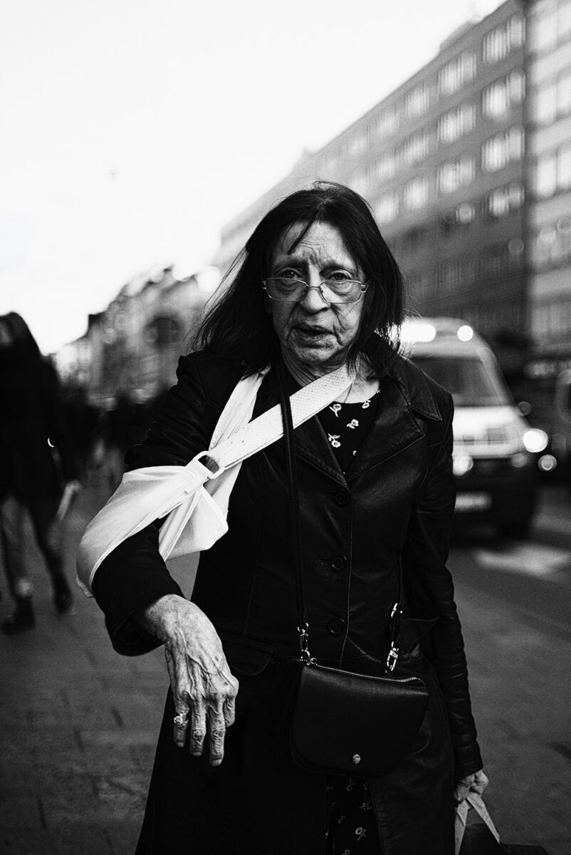 black and white street photo woman stockholm