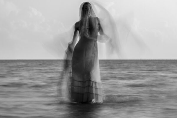 Black and White abstract medium format film portrait of woman in water by Dusty Cooper
