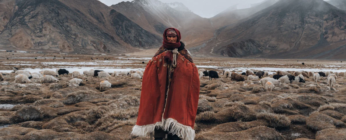 color landscape and portrait photo of a nomadic woman in Ladakh region, India by Wasim Malik