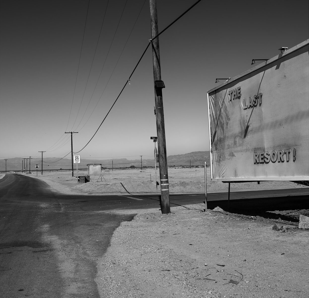 Black & white landscape photography by Bill Holderfield. Desert road.