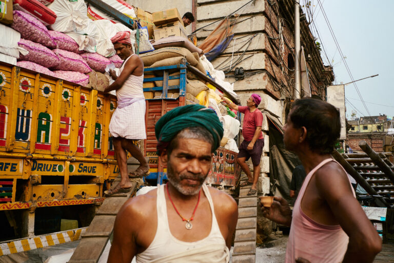 color street photography of workers in India by Connor Bryan