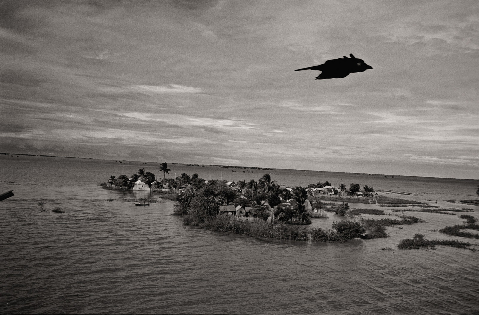 Black & white photography by Ian Berry. Flooded villages in Bangladesh