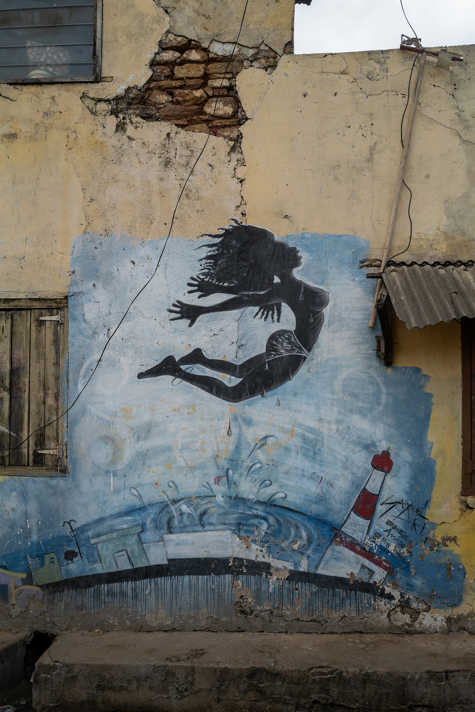 Photography by Kasia Trojak. Mural on a wall in Accra Ghana.