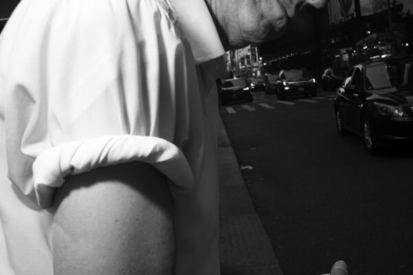 black and white street close up photo of man in New York, USA by Roey Pnini