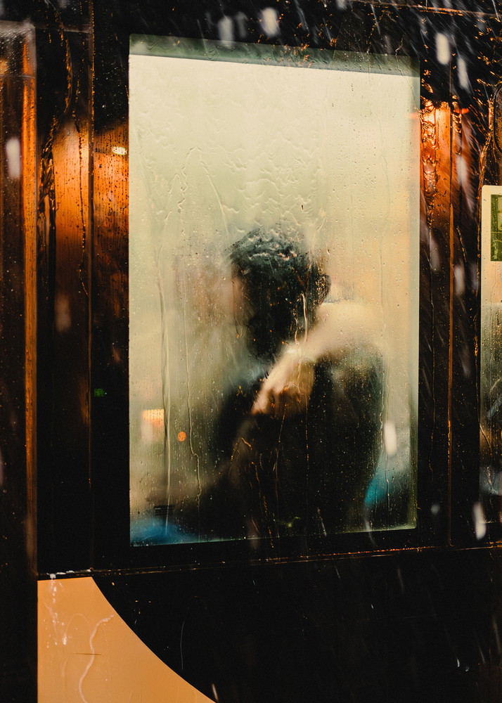 Abstract color candid street shot of a silhouette behind glass captured in Paris, France, by Victor Feillant