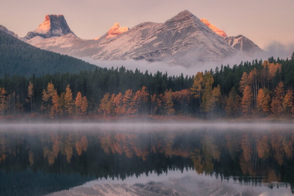 color landscape photo of mountain and lake in Alberta, Canada by Collin Toews