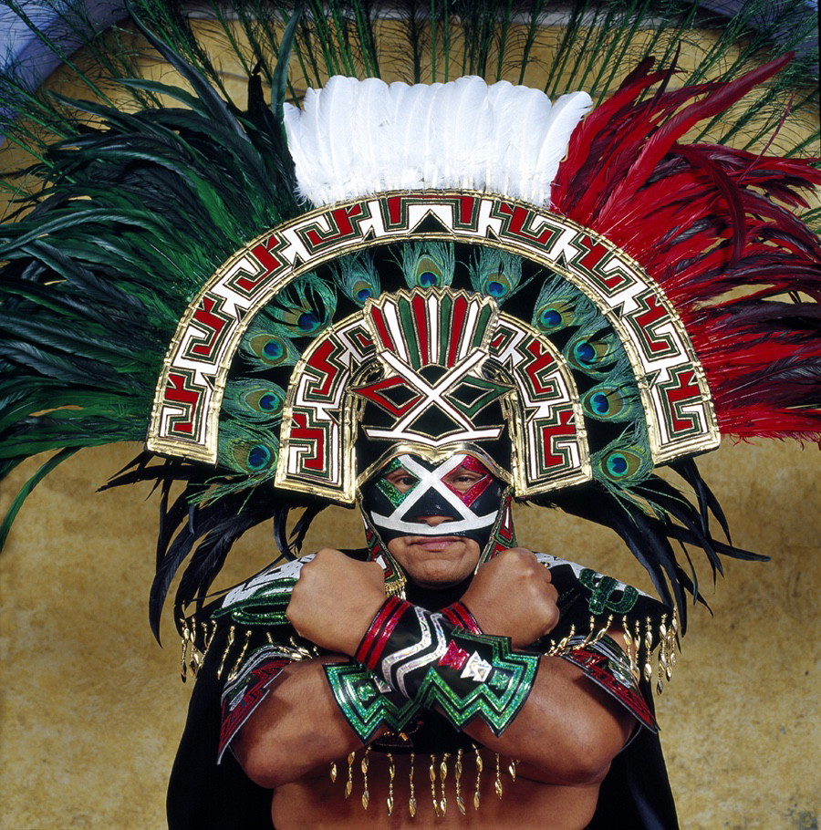 Portrait photography by Lourdes Grobet. Masked wrestler in Mexican colors