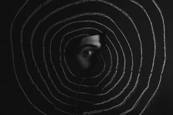 Black and white abstract photo collage of an eye and crayon circles by Alex Othwnos