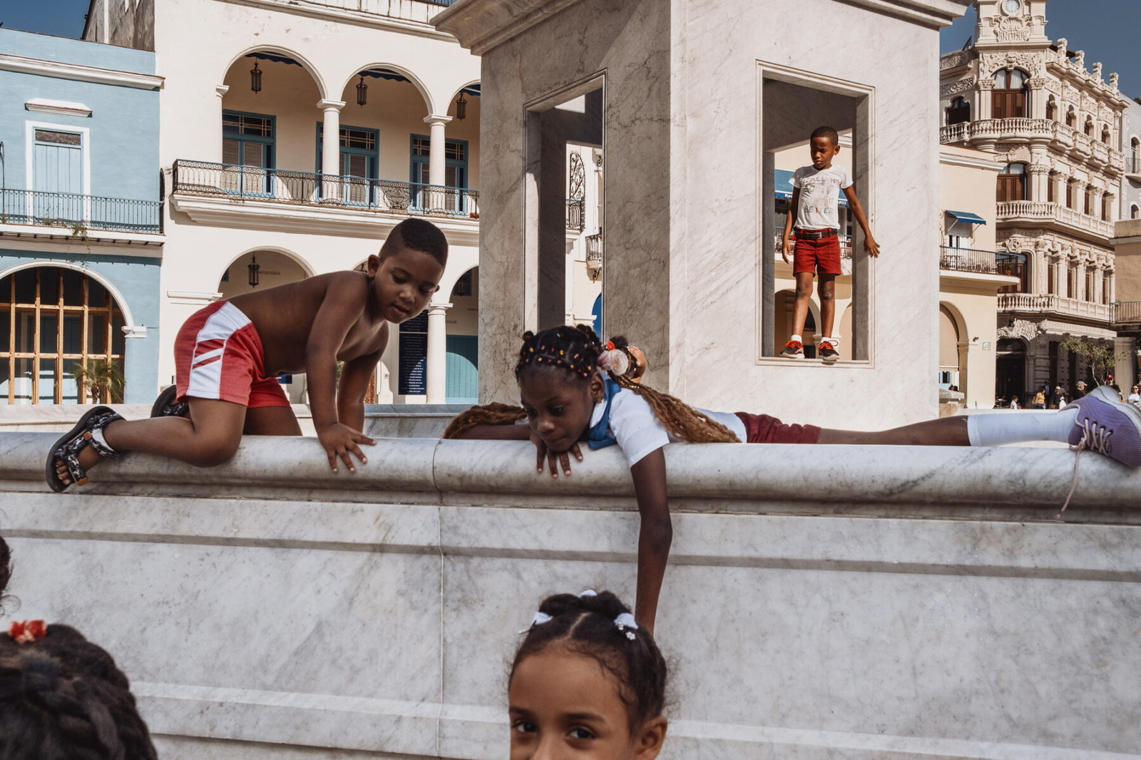 color photo of children playing in the streets of Havana, cuba by Martina Atanassova