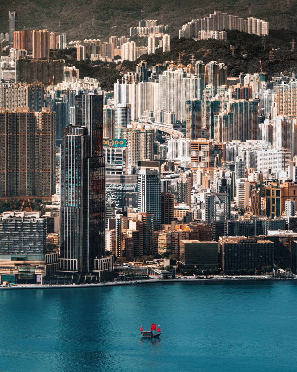 color aerial landscape photo of Hong kong coastline by Derry Ainsworth