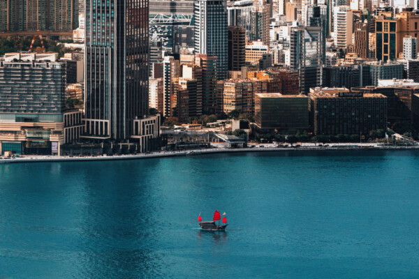 color aerial landscape photo of Hong kong coastline by Derry Ainsworth