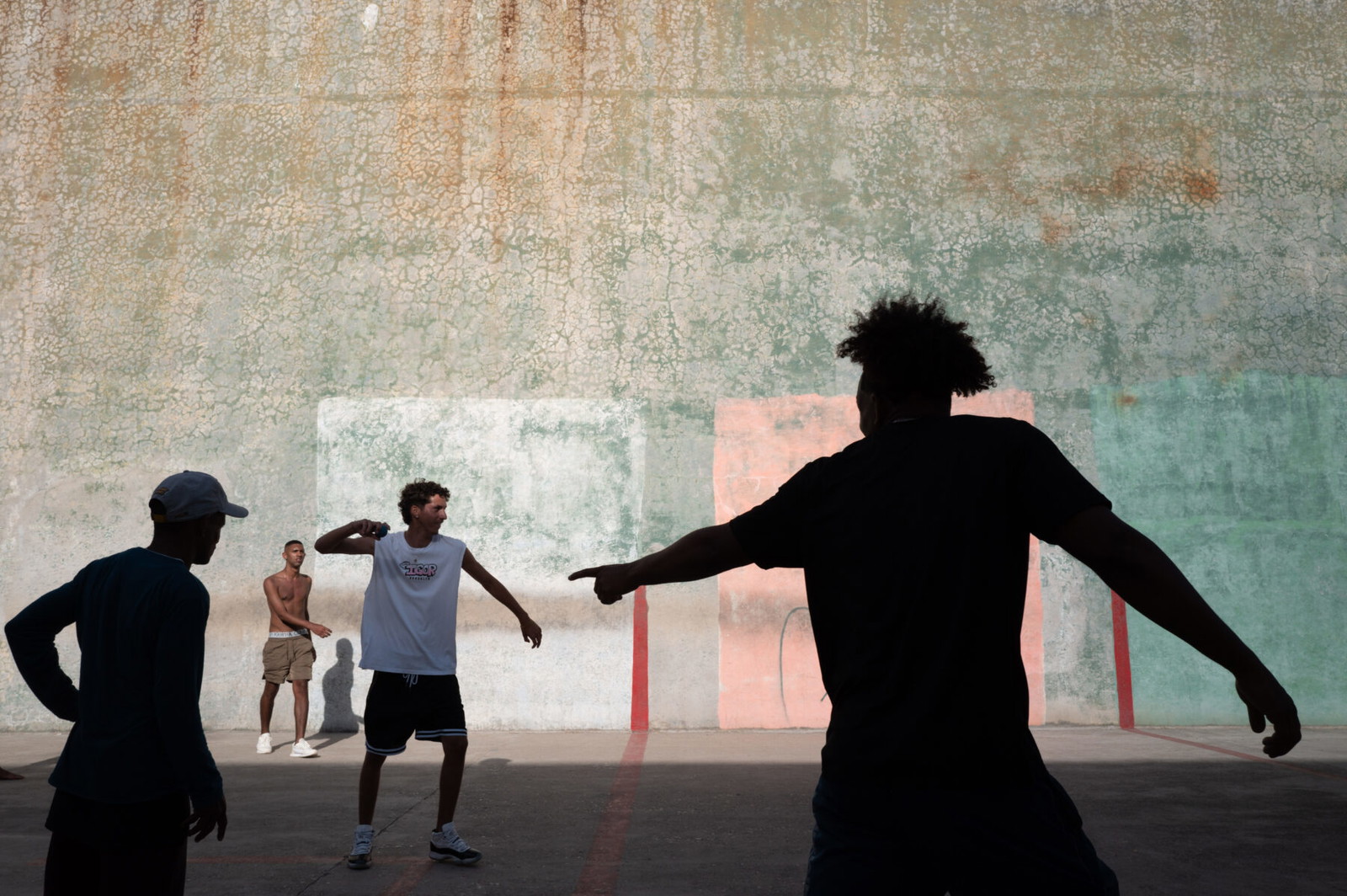 color street photo of youth playing a ball game in Havana, Cuba by Karlynne Wintels