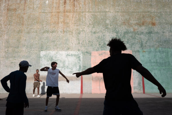 color street photo of youth playing a ball game in Havana, Cuba by Karlynne Wintels