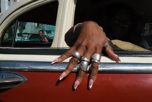 color street photography of woman's hand in car in Havana, Cuba by Linda Jerkin