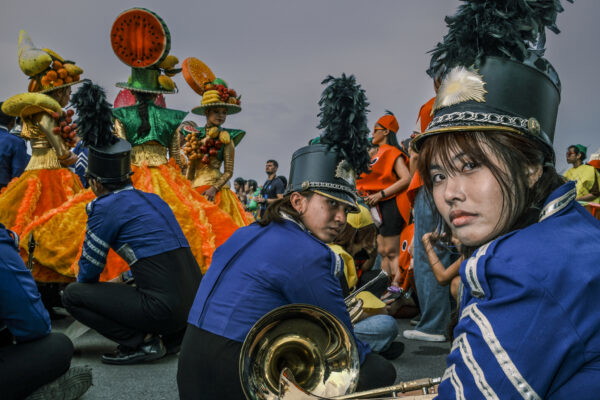color street photo of parade members in Bangkok, Thailand by Paing Htet Aung