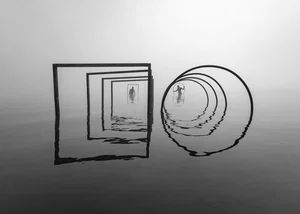 Black and white photo of shapes and two men in water by Leszek Paradowski