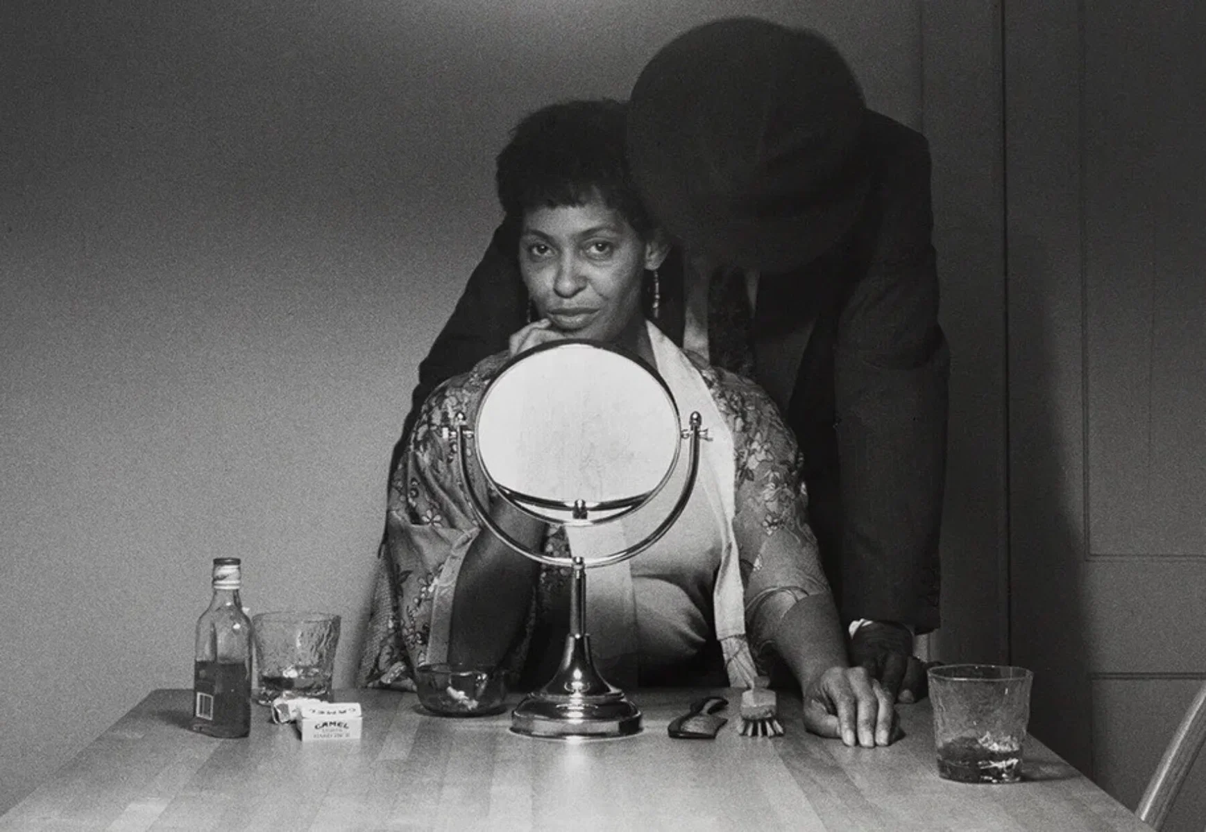 Black and white photo by Carrie Mae Weems from her Kitchen Table Series. From the book Heart of the Matter