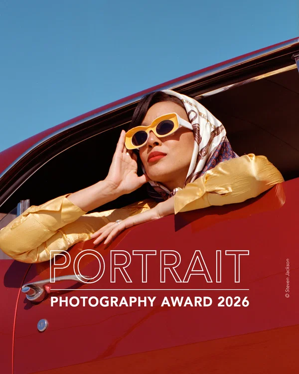 Color portrait fashion photo of woman with sunglasses in red car by