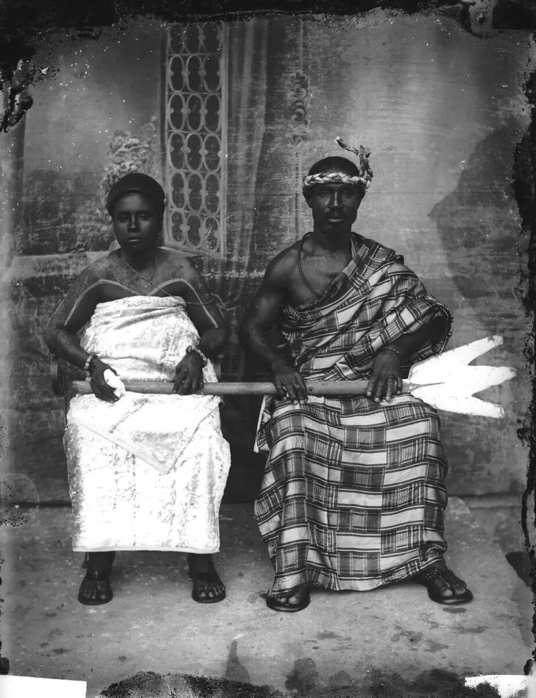 Black and white portrait of a Ghanian man and women in traditional dress by James Kobla Bruce-Vanderpuije