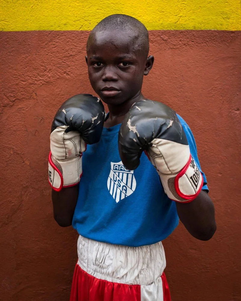 Portrait of a young boxer in Accra, Ghana by Antoine Jonquière