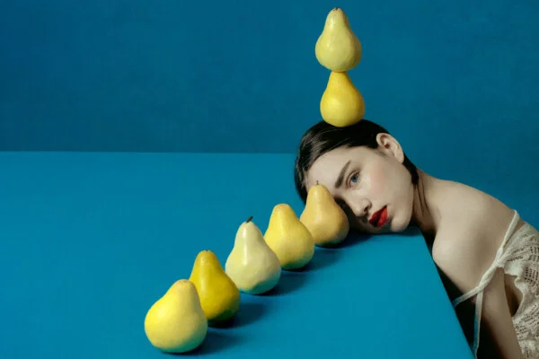 color conceptual studio portrait photo of woman with pears by Elena Paraskeva