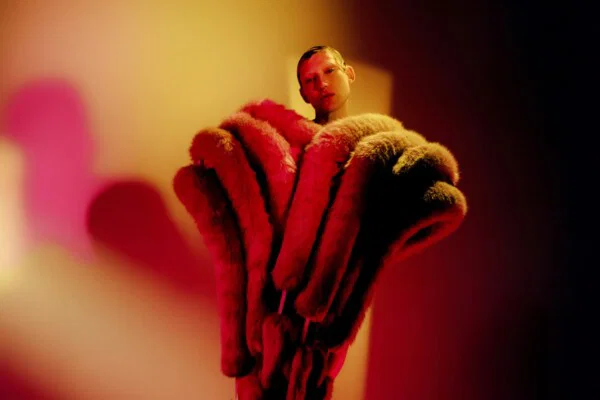 color fashion studio portrait of man with fur by James Morris