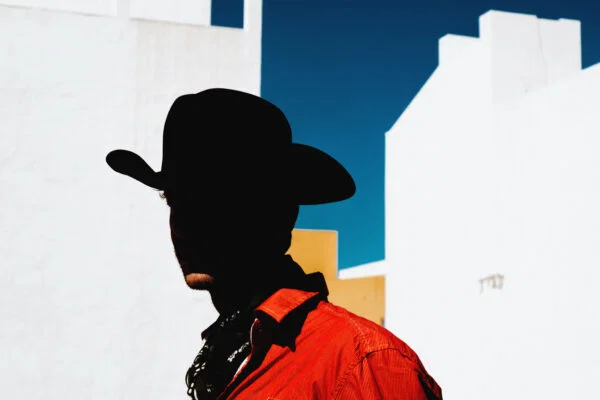 color portrait photo of man with western hat in Fuerteventura, Spain by Wiktor Franko