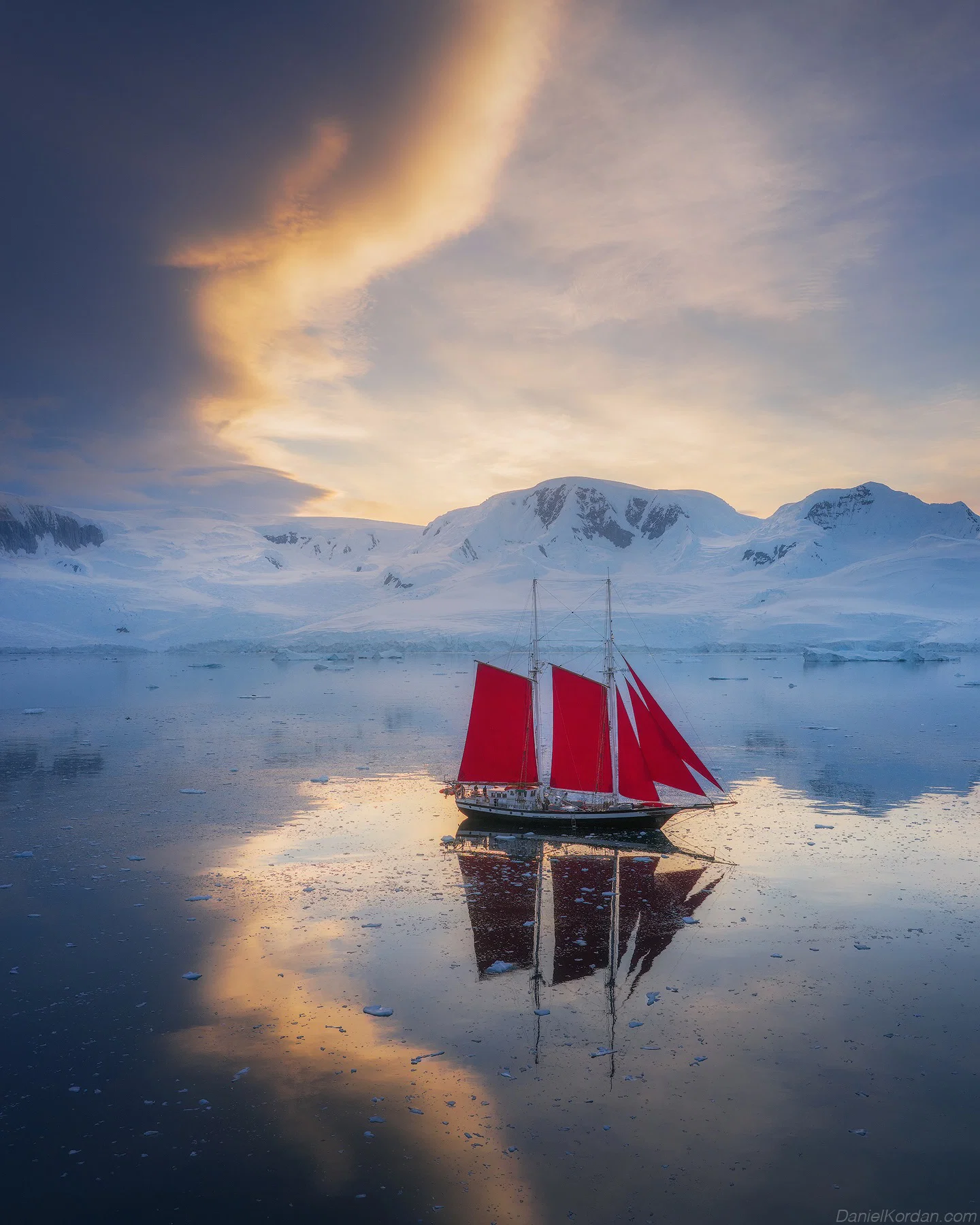 color travel photo of boat sailing by Daniel Kordan