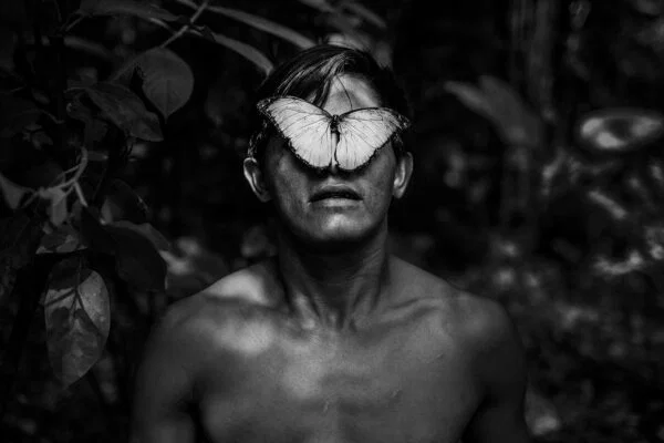 black and white portrait photo of boy in Amazonia by Javier Arcenillas