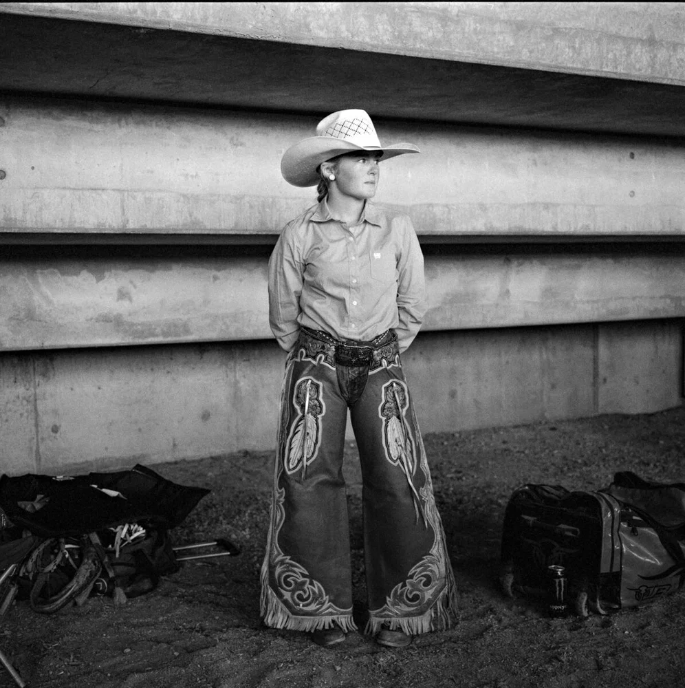 black and white portrait photo of young female horse rider in Australia by Nigel Malone