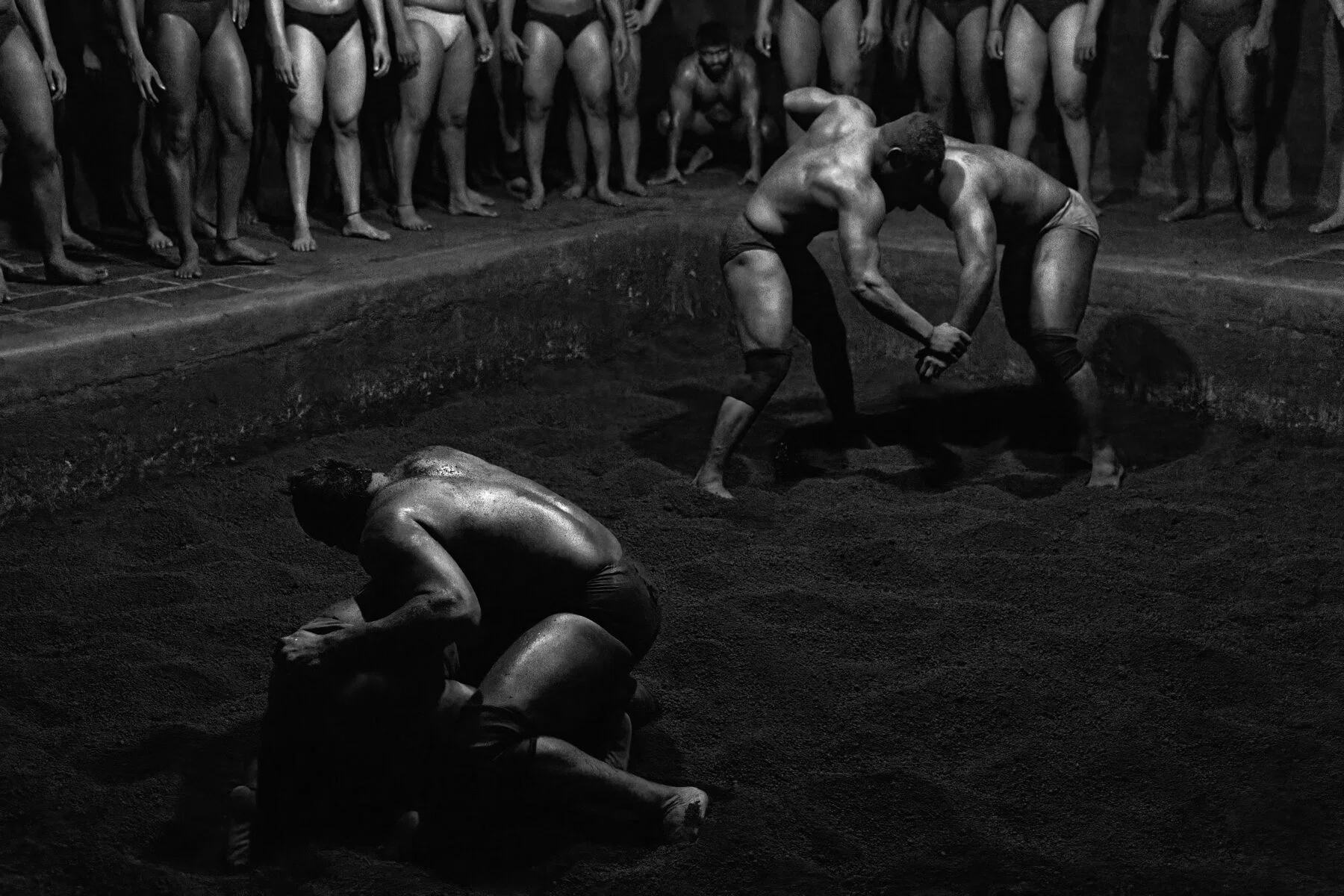 black and white photo of traditional wrestling arena in Kolhapur, India, by Shyjith Onden Cheriyath