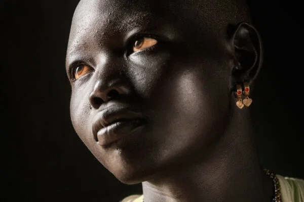 color portrait of a Mundari woman shot in Central Equatoria, South Sudan by Trevor Cole