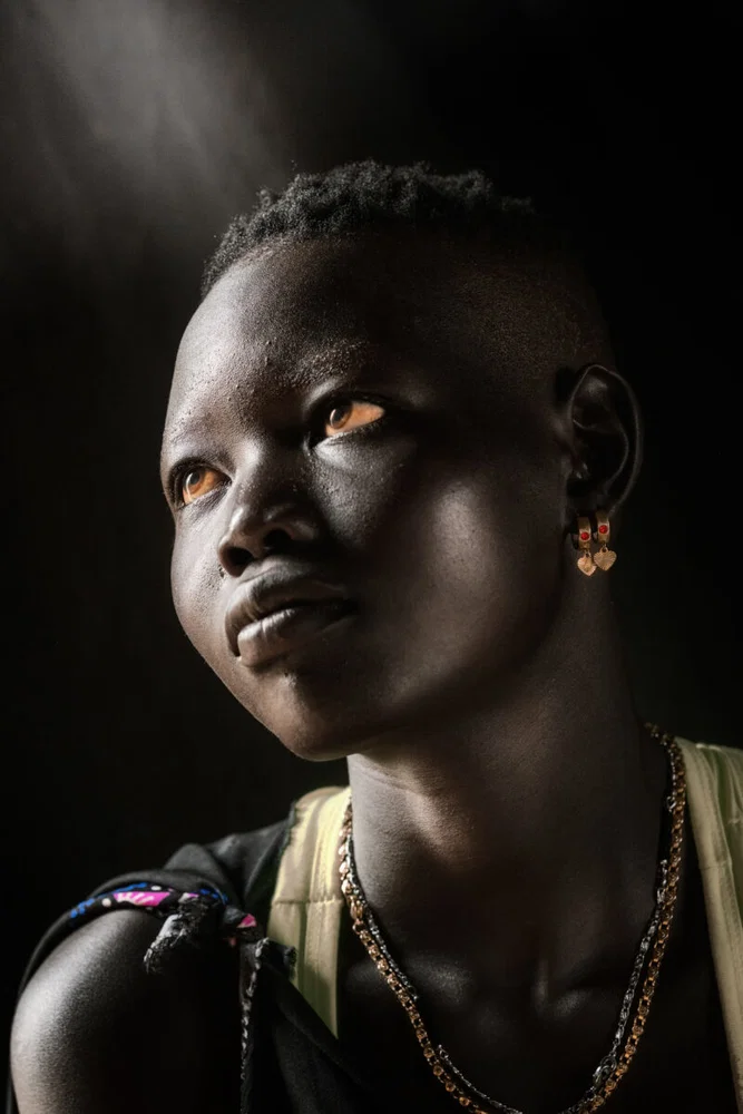 color portrait of a Mundari woman shot in Central Equatoria, South Sudan by Trevor Cole