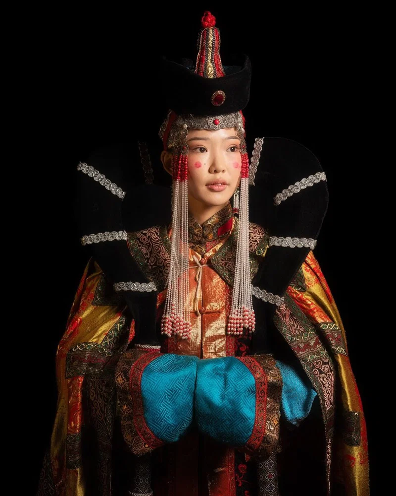 color photo portrait of woman wearing traditionnal clothes in Bhutan by Daniel Kordan